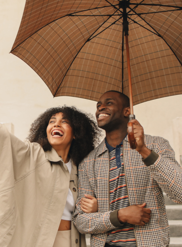 Adult smiling in the rain